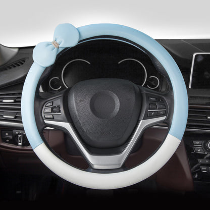 Cute microfiber leather car steering wheel cover, designed for comfort and style. Fits 95% of vehicle models with a size of 38.0 cm x 38.0 cm x 4.0 cm.