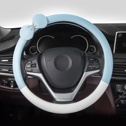 Cute microfiber leather car steering wheel cover, designed for comfort and style. Fits 95% of vehicle models with a size of 38.0 cm x 38.0 cm x 4.0 cm.