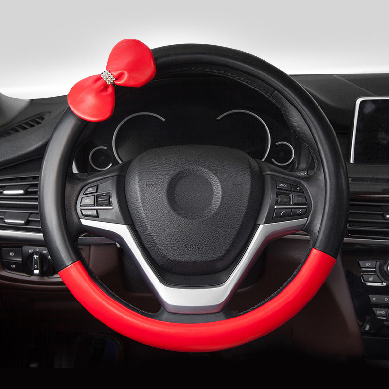 Cute microfiber leather car steering wheel cover, designed for comfort and style. Fits 95% of vehicle models with a size of 38.0 cm x 38.0 cm x 4.0 cm.