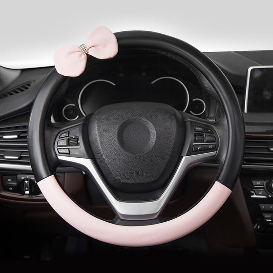 Cute microfiber leather car steering wheel cover, designed for comfort and style. Fits 95% of vehicle models with a size of 38.0 cm x 38.0 cm x 4.0 cm.