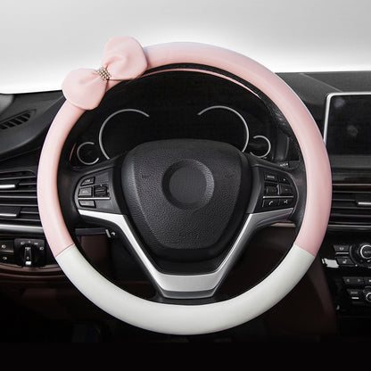 Cute microfiber leather car steering wheel cover, designed for comfort and style. Fits 95% of vehicle models with a size of 38.0 cm x 38.0 cm x 4.0 cm.