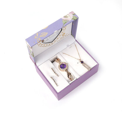  Ladies Jewelry Set featuring alloy material with diamond processing, including earrings, item decorations, hand decorations, and a bamboo link chain with a pendant. Available in red and purple colors, packed individually. Dimensions: 13.5 * 10.5 * 7 cm.