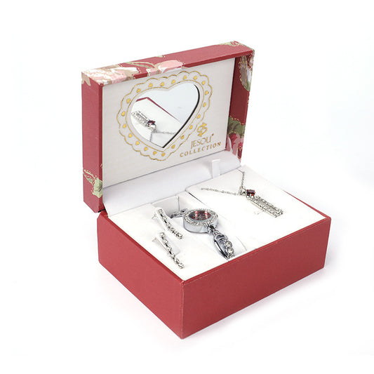  Ladies Jewelry Set featuring alloy material with diamond processing, including earrings, item decorations, hand decorations, and a bamboo link chain with a pendant. Available in red and purple colors, packed individually. Dimensions: 13.5 * 10.5 * 7 cm.