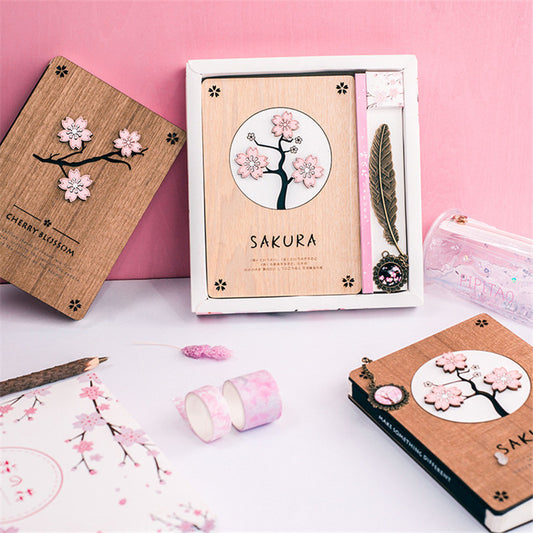 Creative Sakura Notebook Set with carved wooden cover, eco-friendly paper, and crystal bookmark.