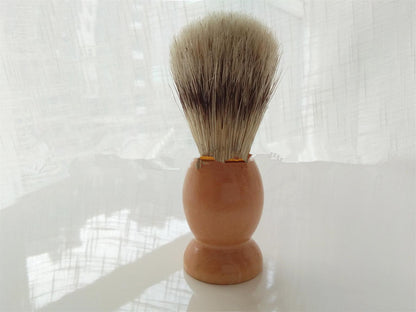 Men's shaving set featuring a metal brush and razor holder made of Fe-Ni alloy, a stainless steel double-layer shaving soap bowl, a 3-layer imported blade razor with a wooden handle, and a bristles shaving brush made from natural bristles. Available in two styles: one with a spare blade and another with two spare blades.