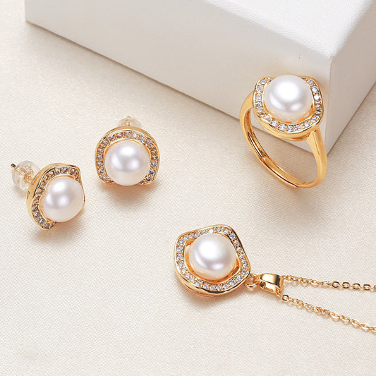 Elegant pearl necklace, ring, and earrings set in various color options, featuring timeless designs and luxurious craftsmanship