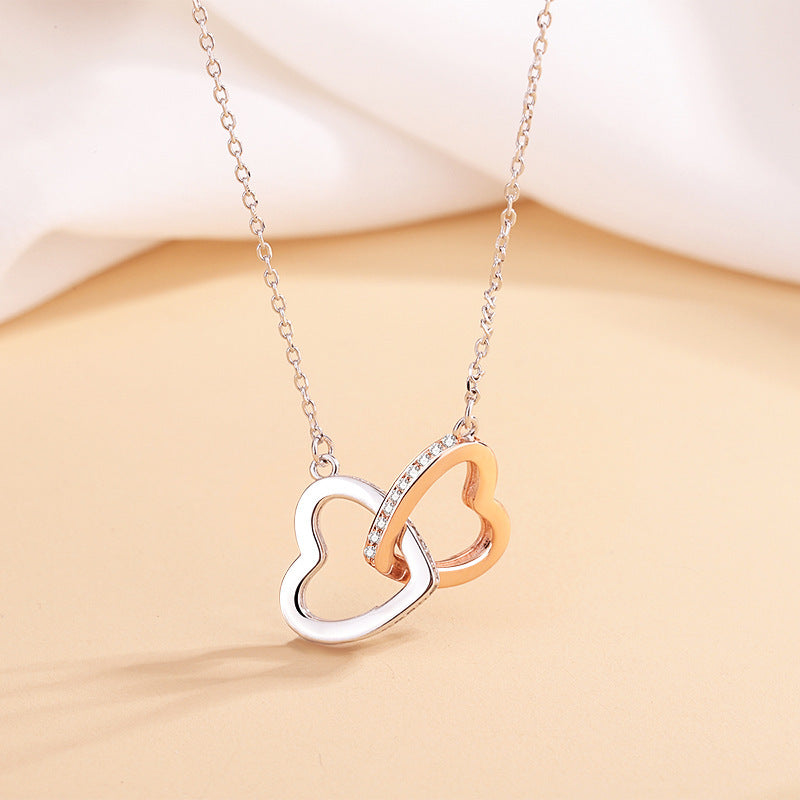 Elegant 925 silver heart necklace with cross chain, featuring double rings and heart pendant. Adjustable length for a perfect fit, a stylish and timeless accessory.
