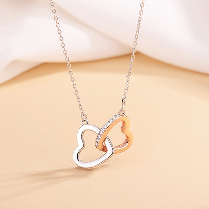 Elegant 925 silver heart necklace with cross chain, featuring double rings and heart pendant. Adjustable length for a perfect fit, a stylish and timeless accessory.