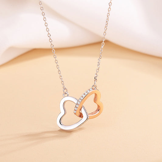 Elegant 925 silver heart necklace with cross chain, featuring double rings and heart pendant. Adjustable length for a perfect fit, a stylish and timeless accessory.