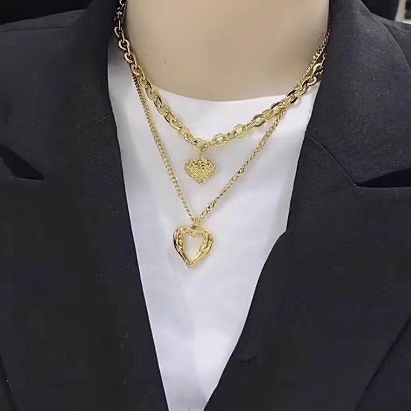 **Love Necklace Gift Set – Stylish & Elegant**  

A beautiful **2-piece necklace set** featuring **heart-shaped** and **geometric pendants** made from **high-quality titanium steel**. Available in **silver** and **golden** colors, with **gold inlaid treatment** for a luxurious finish. The **O-shaped chain** adds comfort and style, perfect for women who love elegant, **Korean-style** accessories.