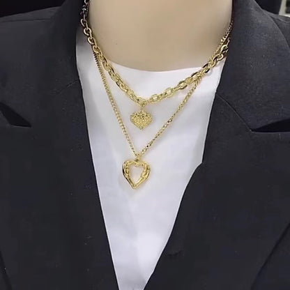 **Love Necklace Gift Set – Stylish & Elegant**  

A beautiful **2-piece necklace set** featuring **heart-shaped** and **geometric pendants** made from **high-quality titanium steel**. Available in **silver** and **golden** colors, with **gold inlaid treatment** for a luxurious finish. The **O-shaped chain** adds comfort and style, perfect for women who love elegant, **Korean-style** accessories.