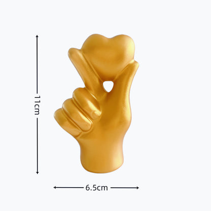 **Love Gesture Resin Ornament** – A beautifully crafted **resin decor piece** symbolizing love and warmth. Available in **red, gold, silver, and white**, it’s compact (**11 × 6.5 × 4 cm**) and perfect for any space. Ideal as a **gift or home accent**. 💖