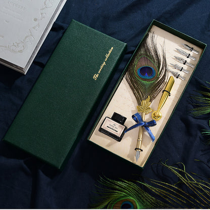 Retro Peacock Feather Pen Set featuring a 25cm feather pen, ink bottle, base with double-sided adhesive, and 5 replacement nibs, all packaged in a sleek 29 * 11.5 * 4CM box.