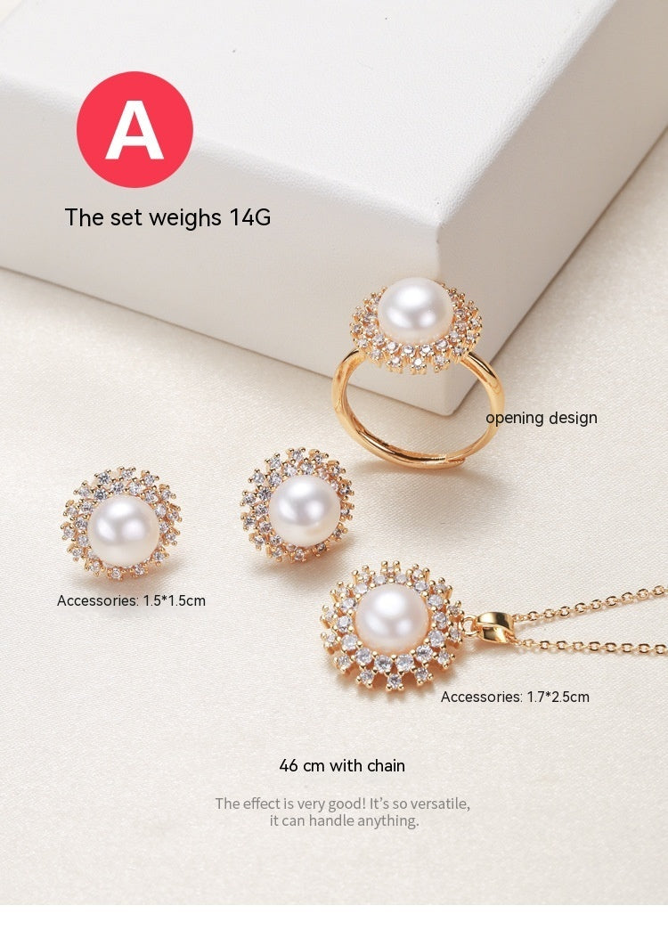 Elegant pearl necklace, ring, and earrings set in various color options, featuring timeless designs and luxurious craftsmanship