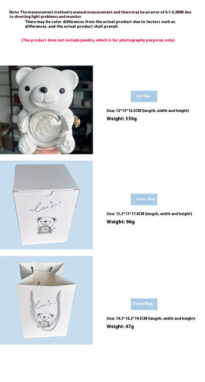 **Rotating Bear Gift Box – Playful & Elegant Packaging 🎁** A **plastic jewelry box** with a **rotating bear design** and **preserved plastic flowers**, perfect for gifting jewelry. Measures **12x13x15.5cm**. Adds charm to your special present! 🎉