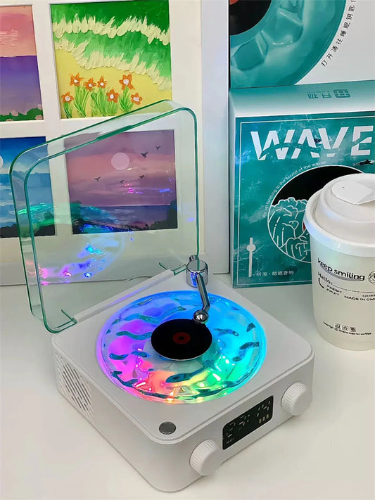 **Retro Turntable Bluetooth Speaker – Vintage Style, Modern Sound 🎶** A portable Bluetooth speaker (142x153x67mm) with a retro design, offering 4 soothing nature sounds like ocean waves and birds. Features 360° surround sound, multiple playback options (Bluetooth, AUX, TF card), and a beautiful breathing light with a transparent turntable. Perfect for parties, relaxation, or enhancing your bedroom ambiance. Available in **blue** and **green**. 🎵