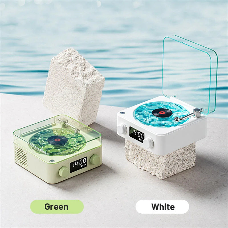 **Retro Turntable Bluetooth Speaker – Vintage Style, Modern Sound 🎶** A portable Bluetooth speaker (142x153x67mm) with a retro design, offering 4 soothing nature sounds like ocean waves and birds. Features 360° surround sound, multiple playback options (Bluetooth, AUX, TF card), and a beautiful breathing light with a transparent turntable. Perfect for parties, relaxation, or enhancing your bedroom ambiance. Available in **blue** and **green**. 🎵