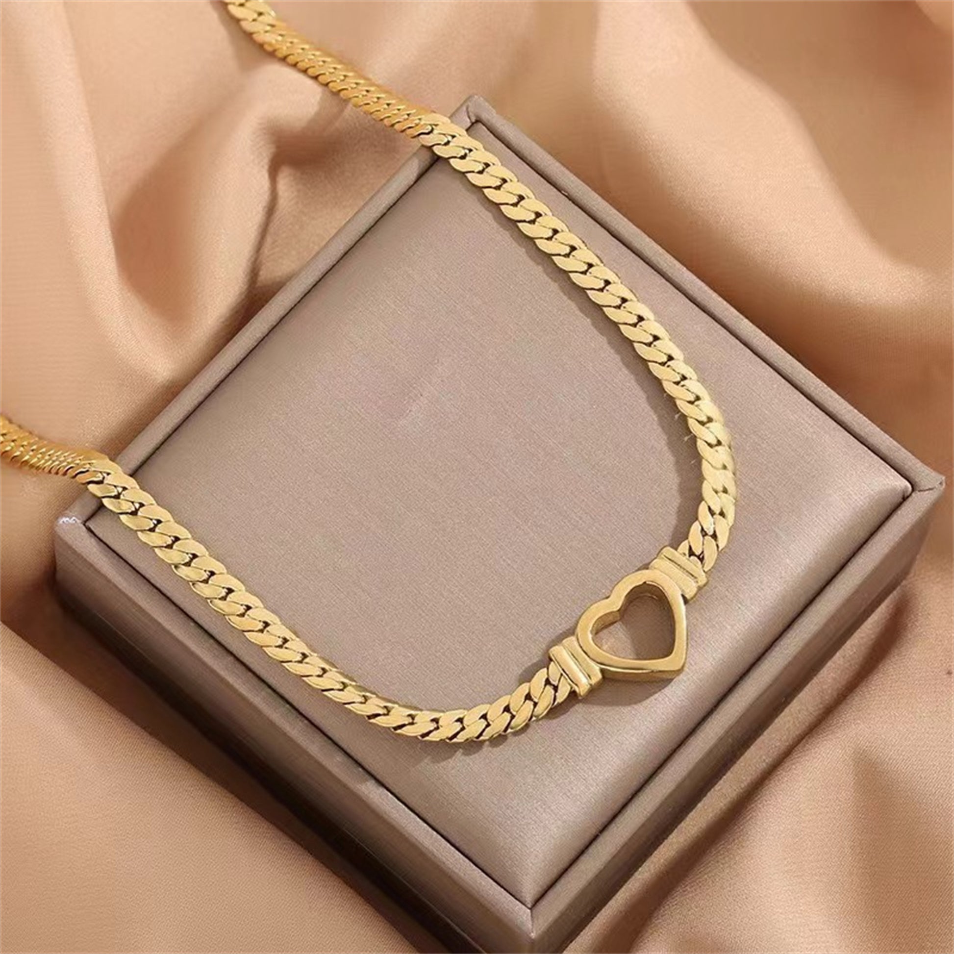 **Love Necklace & Bracelet** – Elegant **heart-shaped jewelry** with a sleek **Cuban chain**. Made from **stainless steel** with an **electroplated finish**, it's stylish, durable, and comfortable to wear. Perfect for any occasion or as a heartfelt gift. 💖
