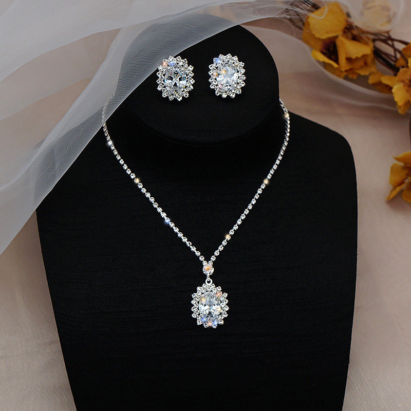 Water Drop Necklace and Earrings Set – Elegant alloy set featuring rhinestone pendant and gold-plated artificial gems. Perfect for weddings, travel souvenirs, and special gifts
