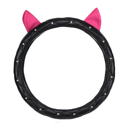 Super cute steering wheel cover made from environmentally friendly PU leather, embellished with high-quality rhinestones and a playful ear design. Suitable for all seasons and most steering wheels.