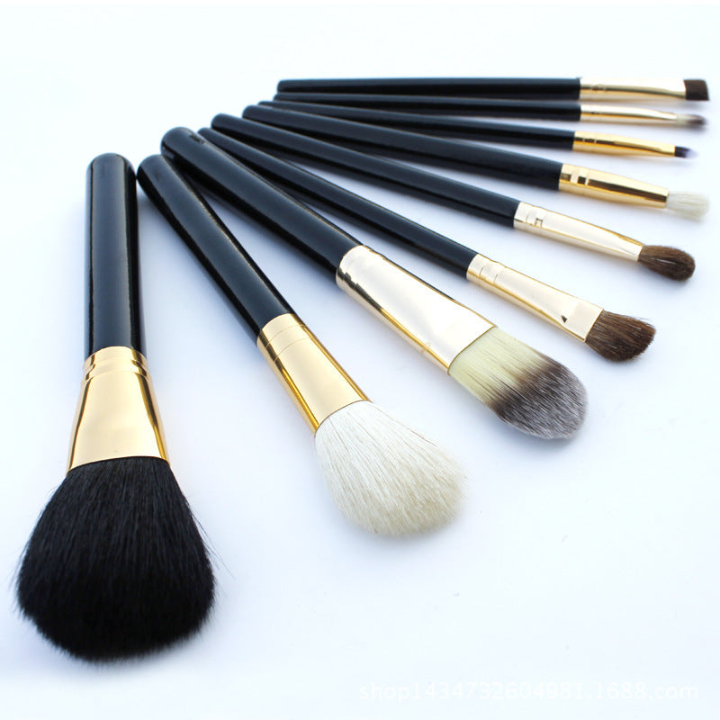 
9-piece Barrel Makeup Brush Set featuring a variety of brushes for powder, foundation, eyeshadow, lips, and eyebrows, crafted with high-quality bristles for precise application.