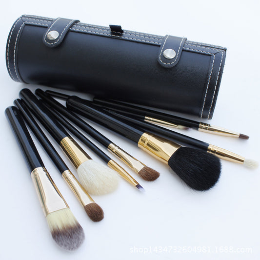 
9-piece Barrel Makeup Brush Set featuring a variety of brushes for powder, foundation, eyeshadow, lips, and eyebrows, crafted with high-quality bristles for precise application.