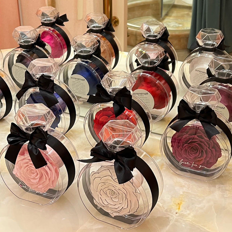 **Rose Gift Box Home Decor – Elegant & Charming 🌹** A stylish **dried flower** arrangement in a **plastic bottle**, available in colors like **Red**, **Pink**, **Sapphire Blue**, and more. Perfect for **Valentine's Day**, **Mother's Day**, and other special occasions. **10x6x14cm**. 🎁