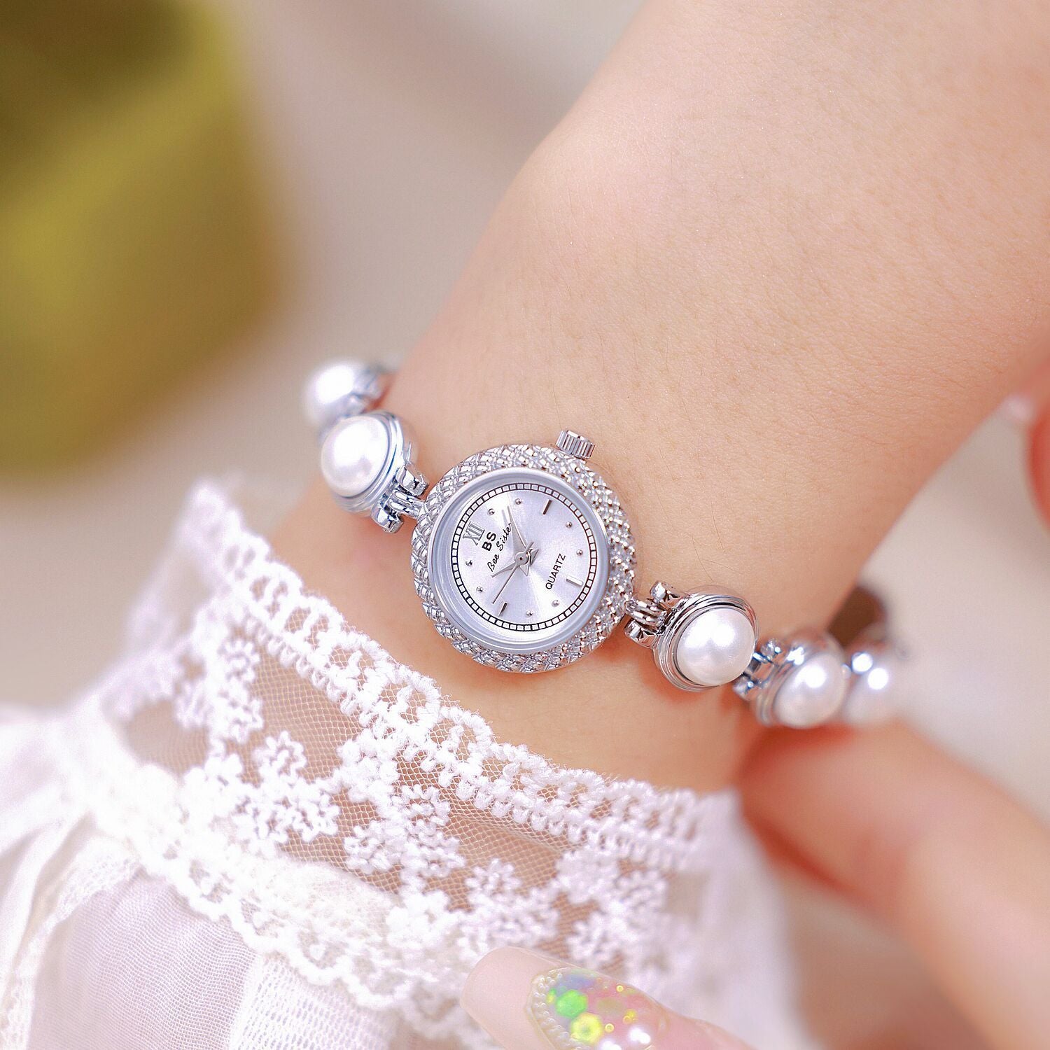 Pearl bracelet women's watch, offering timeless elegance with a fashionable twist for a chic and refined look. #PearlBraceletWatch #TimelessElegance #FashionableTwist #WomensWatch #ChicStyle #LuxuryTimepiece #ElegantAccessories #SophisticatedLook