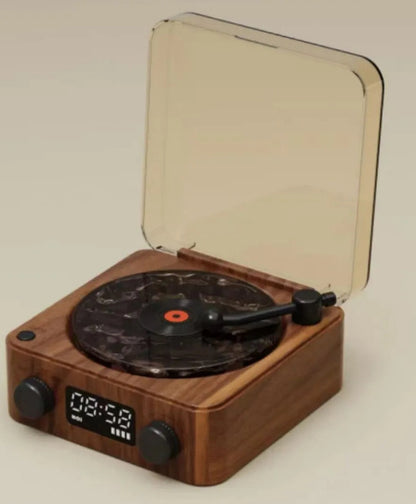 **Retro Turntable Bluetooth Speaker – Vintage Style, Modern Sound 🎶** A portable Bluetooth speaker (142x153x67mm) with a retro design, offering 4 soothing nature sounds like ocean waves and birds. Features 360° surround sound, multiple playback options (Bluetooth, AUX, TF card), and a beautiful breathing light with a transparent turntable. Perfect for parties, relaxation, or enhancing your bedroom ambiance. Available in **blue** and **green**. 🎵