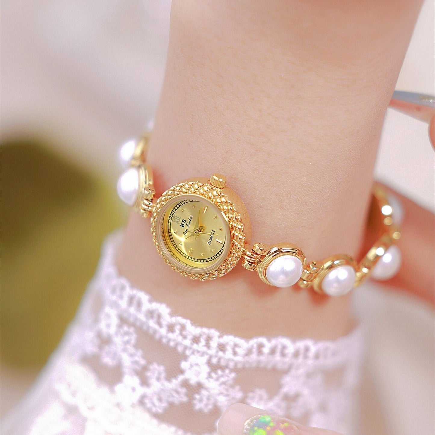 Pearl bracelet women's watch, offering timeless elegance with a fashionable twist for a chic and refined look. #PearlBraceletWatch #TimelessElegance #FashionableTwist #WomensWatch #ChicStyle #LuxuryTimepiece #ElegantAccessories #SophisticatedLook