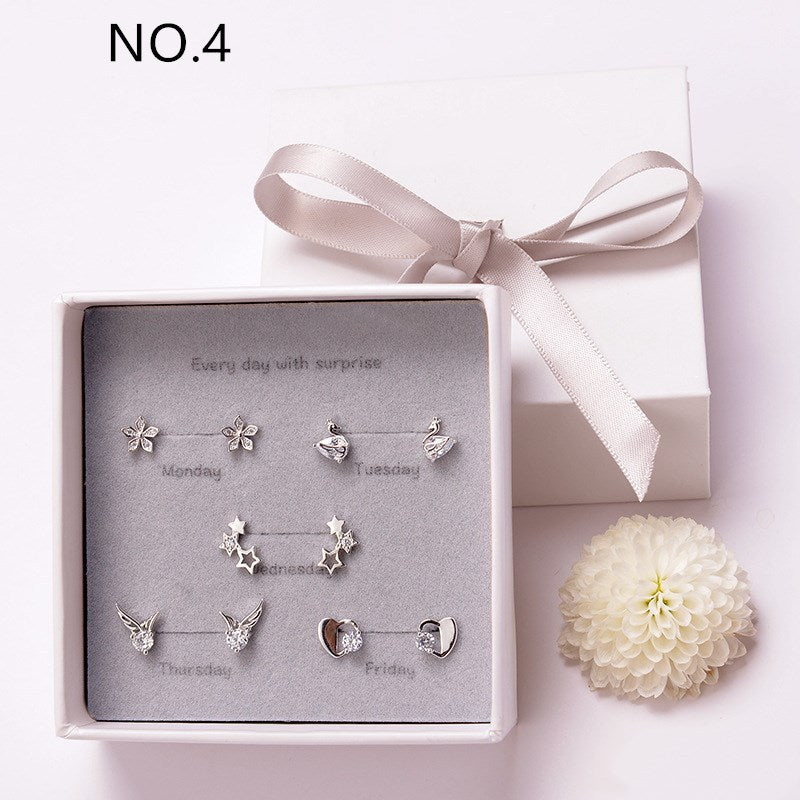 A pair of elegant geometric earrings crafted from copper plated with real platinum, packaged individually for a sophisticated look.