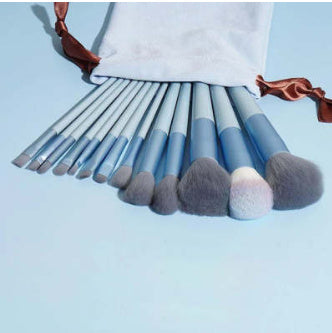 A 13-piece makeup brush set featuring soft synthetic bristles, durable plastic handles, and aluminum ferrules. The set includes brushes for foundation, powder, blush, highlighter, eyeshadow, lip, eyebrow, concealer, and blending. Available in various packaging options such as cloth bags and boxes in green, pink, and yellow. Ideal for professional and personal use, providing precise application and easy cleaning.
