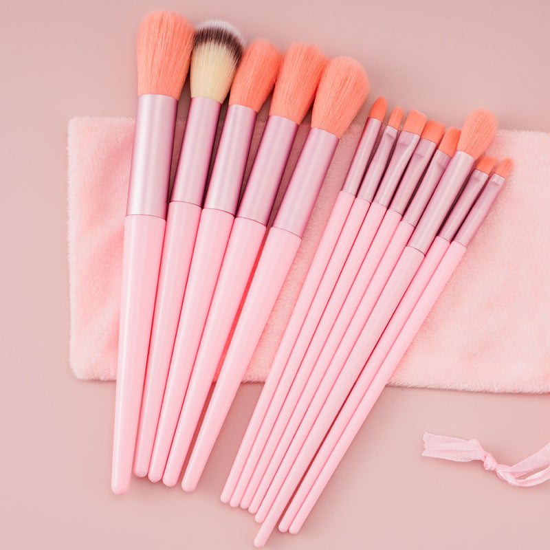 A 13-piece makeup brush set featuring soft synthetic bristles, durable plastic handles, and aluminum ferrules. The set includes brushes for foundation, powder, blush, highlighter, eyeshadow, lip, eyebrow, concealer, and blending. Available in various packaging options such as cloth bags and boxes in green, pink, and yellow. Ideal for professional and personal use, providing precise application and easy cleaning.