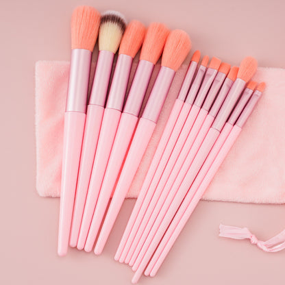 A 13-piece makeup brush set featuring soft synthetic bristles, durable plastic handles, and aluminum ferrules. The set includes brushes for foundation, powder, blush, highlighter, eyeshadow, lip, eyebrow, concealer, and blending. Available in various packaging options such as cloth bags and boxes in green, pink, and yellow. Ideal for professional and personal use, providing precise application and easy cleaning.