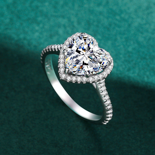 Elegant heart-shaped silver ring with inlaid zircon, featuring a luxurious design. Available in multiple sizes, perfect for women who love timeless and romantic jewelry.