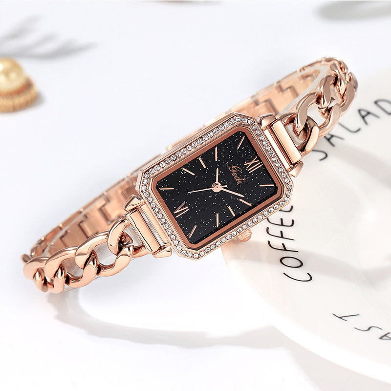 Luxury ladies watch featuring a sleek square dial with a choice of red, gold plate, starry sky black, or small green color options. The 8mm thick watch boasts a mineral reinforced glass mirror, a jewelry buckle, and a stainless steel back for durability and style.