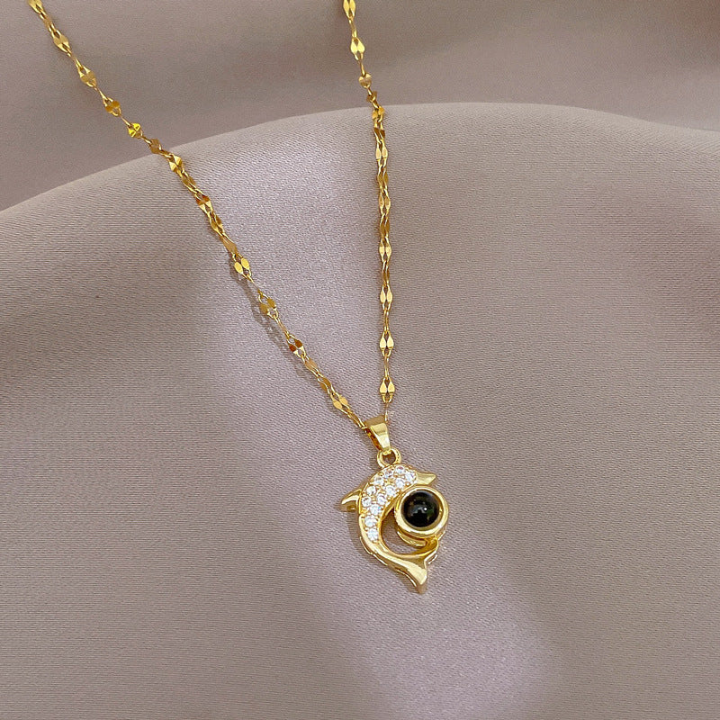 Exquisite dolphin stone necklace, featuring a unique and elegant design. Perfect for adding exotic charm to any outfit.