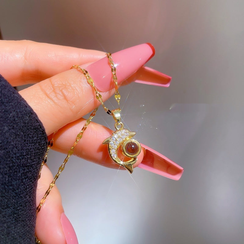 Exquisite dolphin stone necklace, featuring a unique and elegant design. Perfect for adding exotic charm to any outfit.