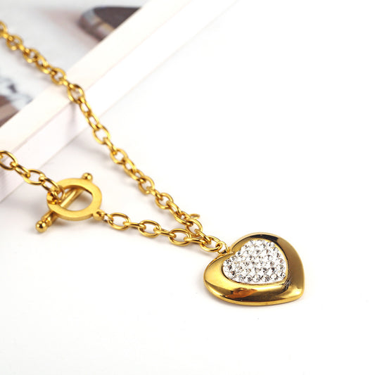 Heart-Shaped Rhinestone Jewelry Set made of titanium steel, featuring a necklace (45cm) and bracelet (20cm) with manual polishing. Available in steel color and gold.