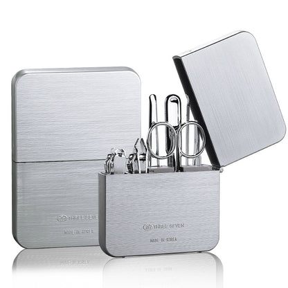 Nail clippers set made of carbon steel, including a diagonal cut clipper, flat cut clipper, dead skin shovel, nail file, eyebrow clip, ear pick, and eyebrow scissors for complete grooming.