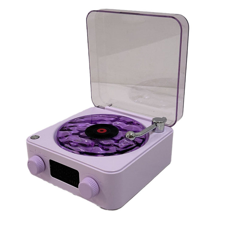 **Retro Turntable Bluetooth Speaker – Vintage Style, Modern Sound 🎶** A portable Bluetooth speaker (142x153x67mm) with a retro design, offering 4 soothing nature sounds like ocean waves and birds. Features 360° surround sound, multiple playback options (Bluetooth, AUX, TF card), and a beautiful breathing light with a transparent turntable. Perfect for parties, relaxation, or enhancing your bedroom ambiance. Available in **blue** and **green**. 🎵