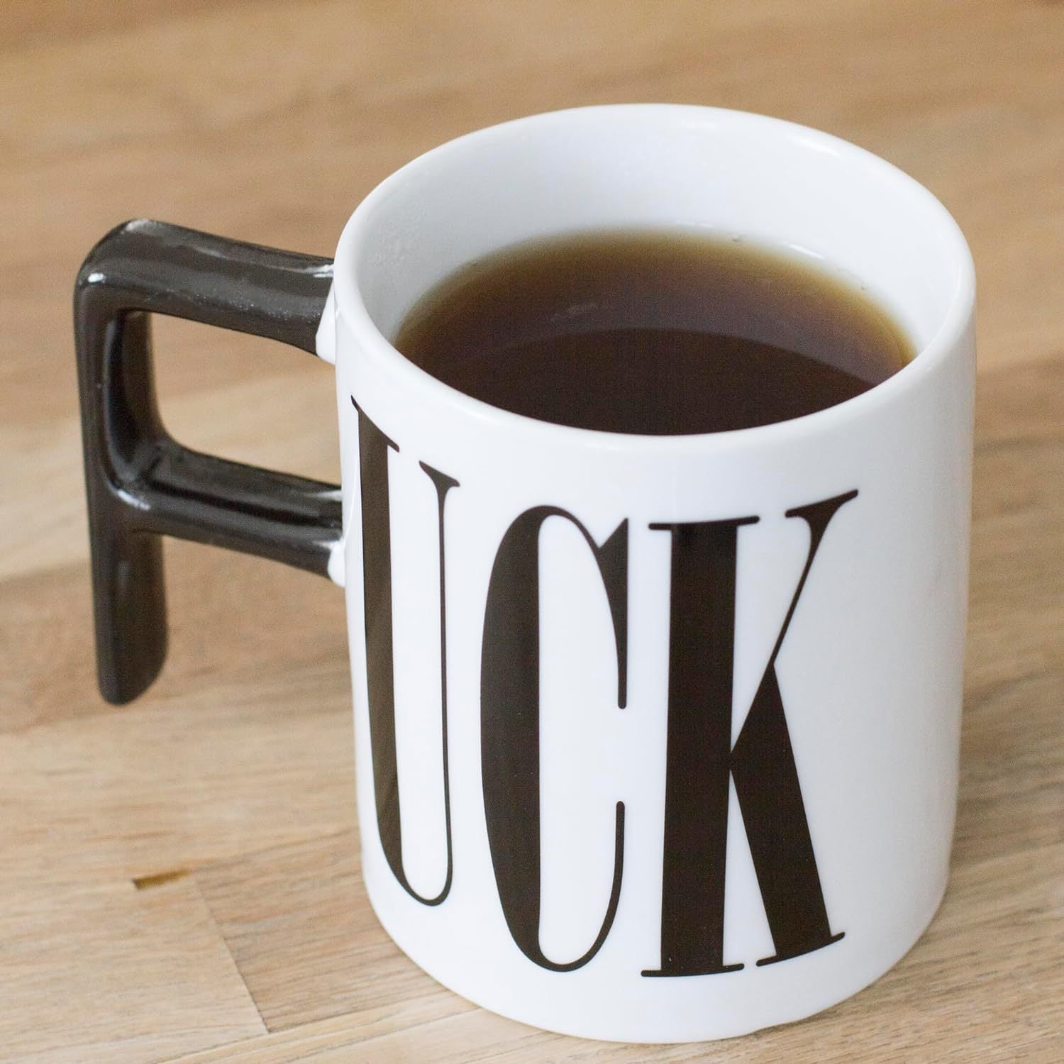 Humorous painted pottery mug featuring bold designs ("FUCK" and "DICK"), perfect for adding a playful touch to your daily beverage routine.