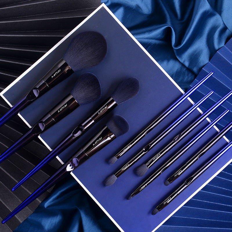 Blue 10-piece makeup brush set featuring soft nylon wool bristles, plastic handles, and a stylish gift box or envelope package, perfect for professional and everyday use.