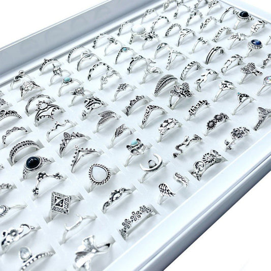A stylish set of 100 fashion-forward silver alloy rings featuring geometric designs, perfect for adding a trendy touch to any outfit. Each set offers a random selection of styles, ensuring variety and versatility.