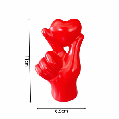 **Love Gesture Resin Ornament** – A beautifully crafted **resin decor piece** symbolizing love and warmth. Available in **red, gold, silver, and white**, it’s compact (**11 × 6.5 × 4 cm**) and perfect for any space. Ideal as a **gift or home accent**. 💖