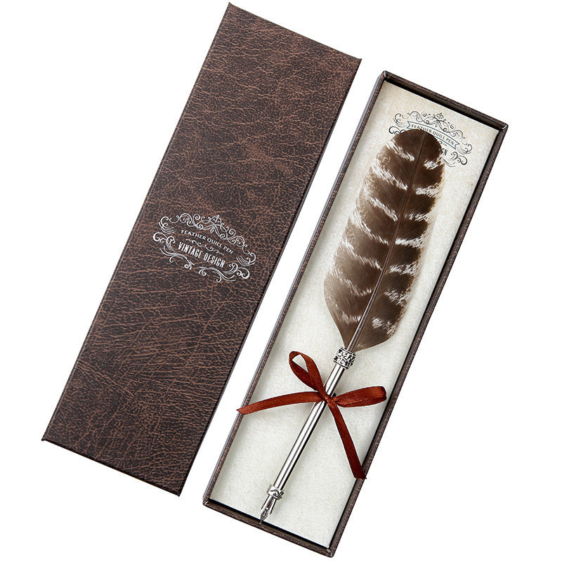 **Elegant Retro Feather Pen Gift Set – Vintage Writing Experience**  

A beautifully crafted **stainless steel feather pen** set in a stylish **gift box**, perfect for writers, calligraphy enthusiasts, and collectors. Timeless design meets smooth writing for an unforgettable experience. Ideal for gifting on any occasion! 🎁✒️