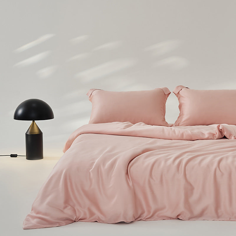 Luxuriously soft Four-Piece Ice Silk Bed Sheets made from breathable Lyocell fiber (Tencel). Features a modern minimalist design, reactive dyeing for long-lasting color, and a silky-smooth texture for year-round comfort. Available in multiple sizes.