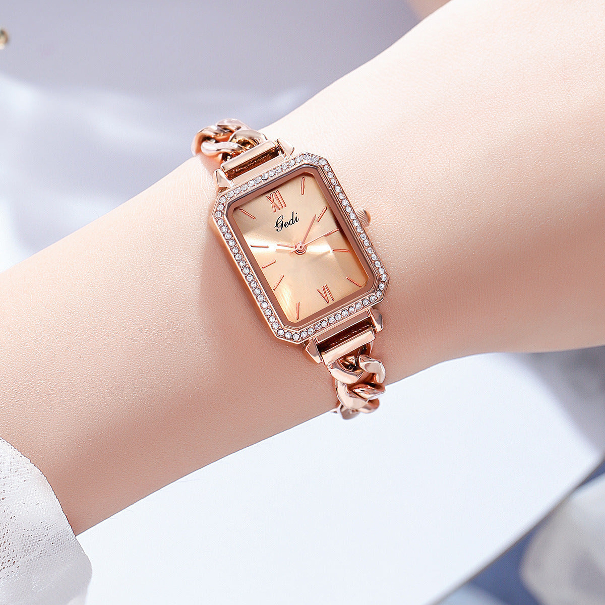 Luxury ladies watch featuring a sleek square dial with a choice of red, gold plate, starry sky black, or small green color options. The 8mm thick watch boasts a mineral reinforced glass mirror, a jewelry buckle, and a stainless steel back for durability and style.