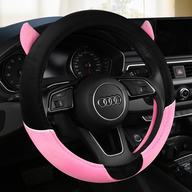 Cute cartoon plush steering wheel cover designed for all seasons, providing comfort and warmth. Fits most car models and adds a playful touch to your car's interior.