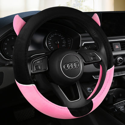 Cute cartoon plush steering wheel cover designed for all seasons, providing comfort and warmth. Fits most car models and adds a playful touch to your car's interior.